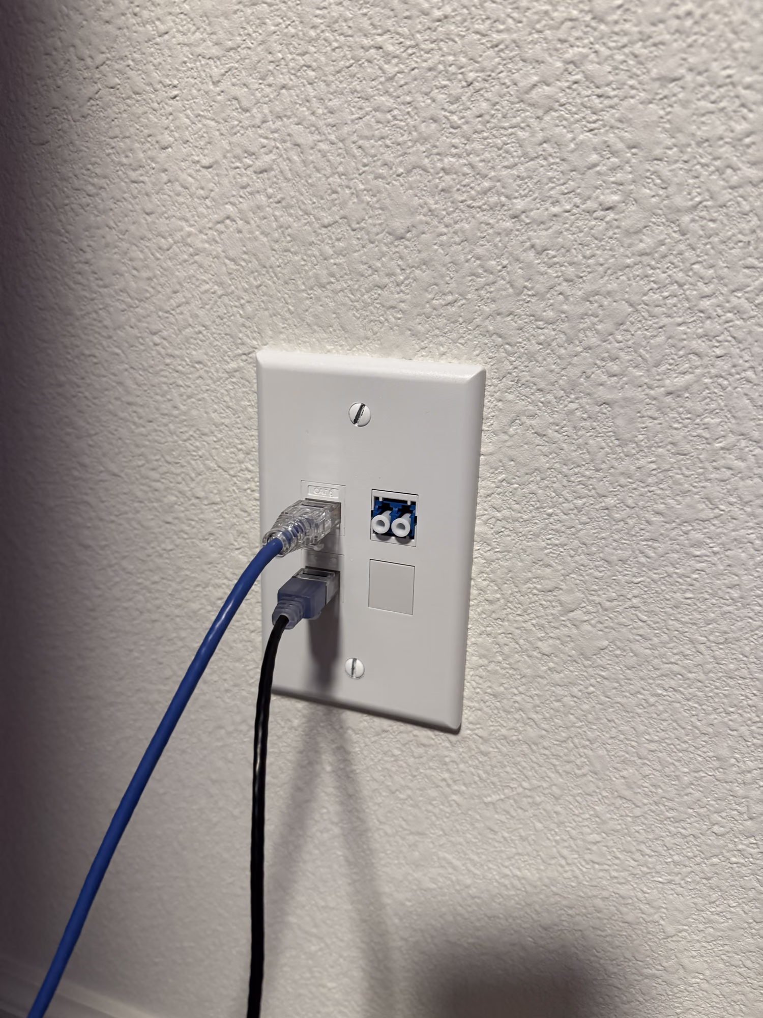Office wall plate with two CAT6 keystones patched and a duplex LC singlemode drop